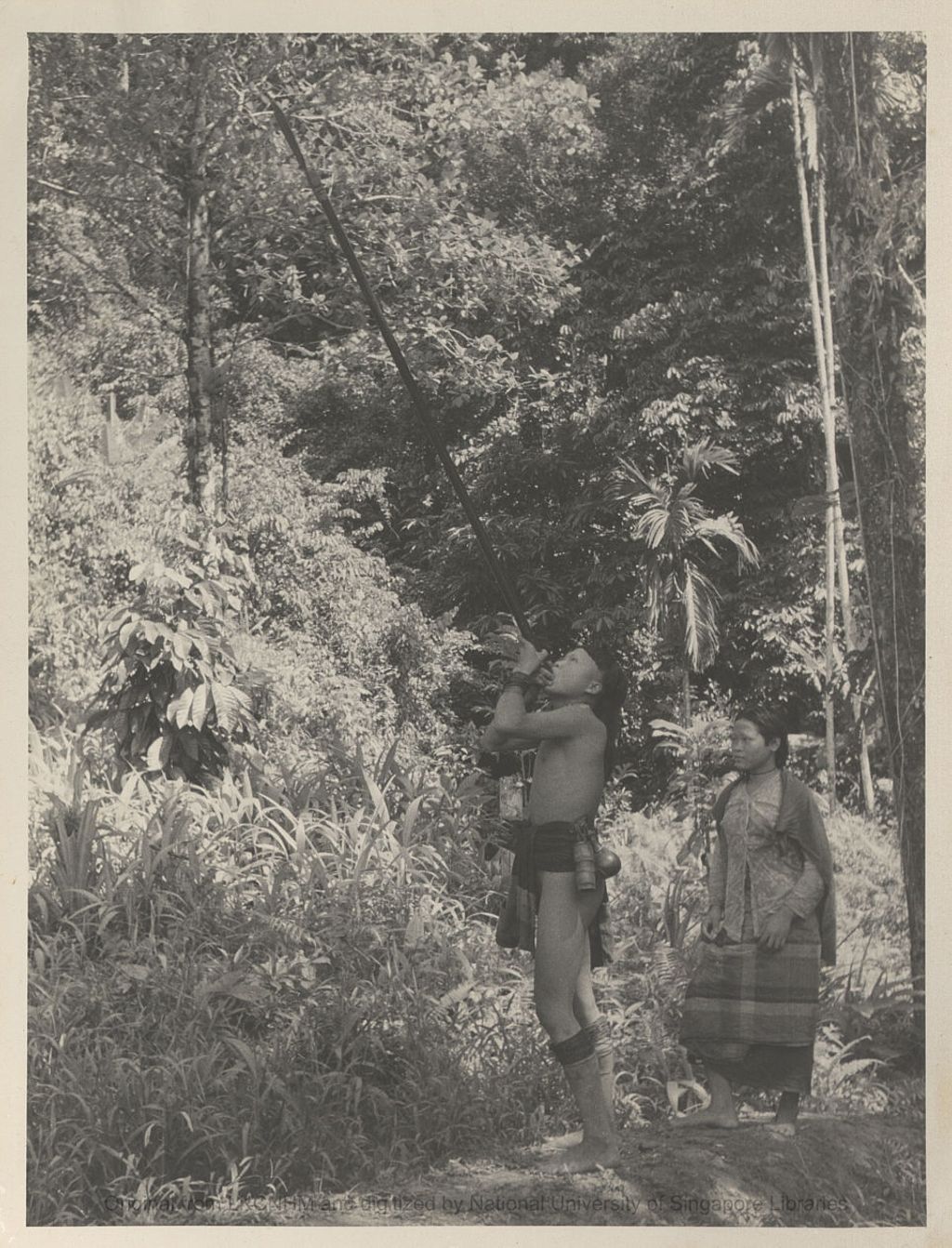 Miniature of Penan couple guarding the cave at Toking, Long Laput, Baram